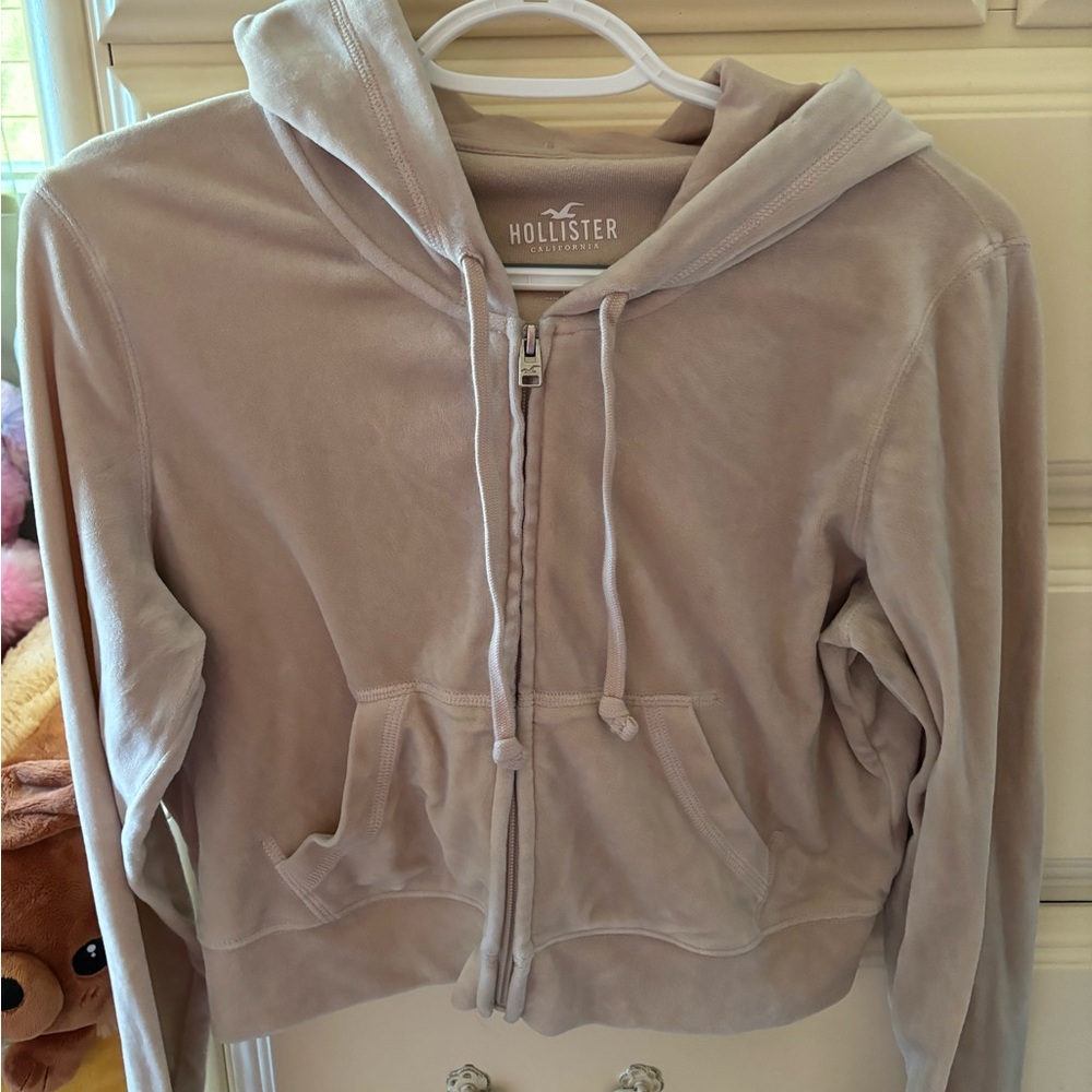 Beige fuzzy cropped zip up.